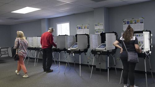 Gwinnett County residents casts their ballots last March. (ALYSSA POINTER/ALYSSA.POINTER@AJC.COM) AJC FILE PHOTO