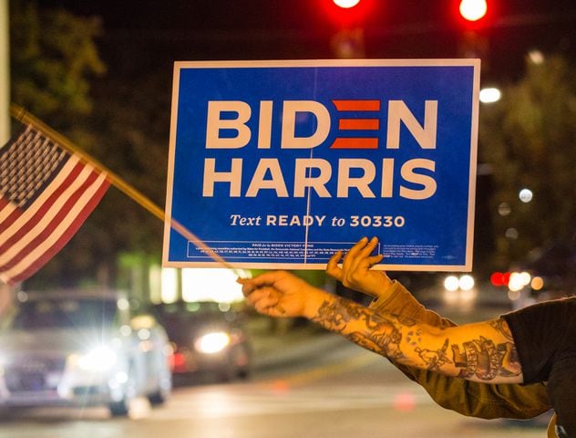 As elections results become more clear, Biden supporters take to the streets in Decatur and East Altanta to celebrate President-Elect Joe Biden and his VP Kamala Harris on Saturday, Nov 7, 2020.  (Jenni Girtman for The Atlanta Journal-Constitution)