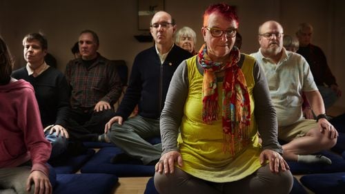 Sue Lesser, front right, joins others in a Sunday morning open meditation at the Shambhala Meditation Center in the Madison Valley neighborhood of Seattle. (Benjamin Benschneider/Seattle Times/TNS)