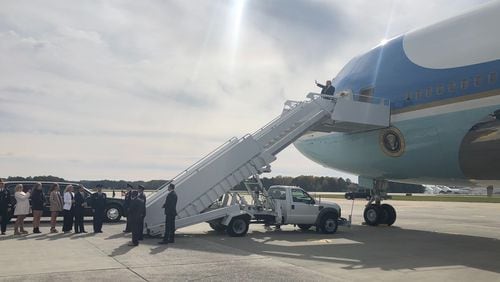 President Donald Trump steps out of Air Force One after landing at Dobbins Air Reserve Base on Friday, Nov. 8, 2019.