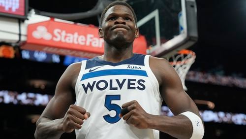 Minnesota Timberwolves guard Anthony Edwards celebrates a foul against the Phoenix Suns during the first half of Game 4 of an NBA basketball first-round playoff series, Sunday, April 28, 2024, in Phoenix. The Timberwolves won 122-116, taking the series 4-0. (AP Photo/Ross D. Franklin)
