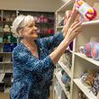 Happy Caps founder, Kathy DeJoseph grabs more supplies in the yarn room for Happy Caps volunteers as they knit caps for patients at the Wellstar West-Cobb Medical Center in Marietta.  PHIL SKINNER FOR THE ATLANTA JOURNAL-CONSTITUTION