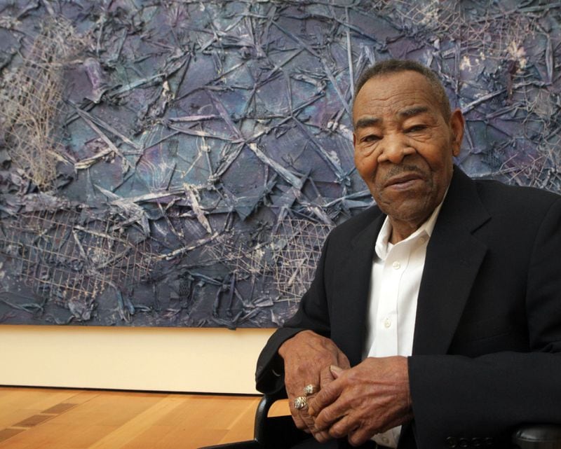 November 1, 2012-ATLANTA: Portrait of artist Thornton Dial in front of his latest work, "Crossing Waters," which is part of a new show at the High Museum in Atlanta on Wednesday Nov. 1st, 2012. The exhibit, opening Nov. 3rd, is the most extensive survey of about 20 years of Dial's work with major painting, drawing at sculpture assemblages. PHIL SKINNER / PSKINNER@AJC.COM editor's note: CQ, according to gallery info