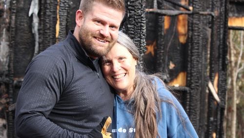 Chris Autry (left) and his wife (not pictured) started a GoFundMe account to raise money to rebuild Sandy Lyndon’s tiny house, which burned down Nov. 27. ELLEN ELDRIDGE / ELLEN.ELDRIDGE@AJC.COM