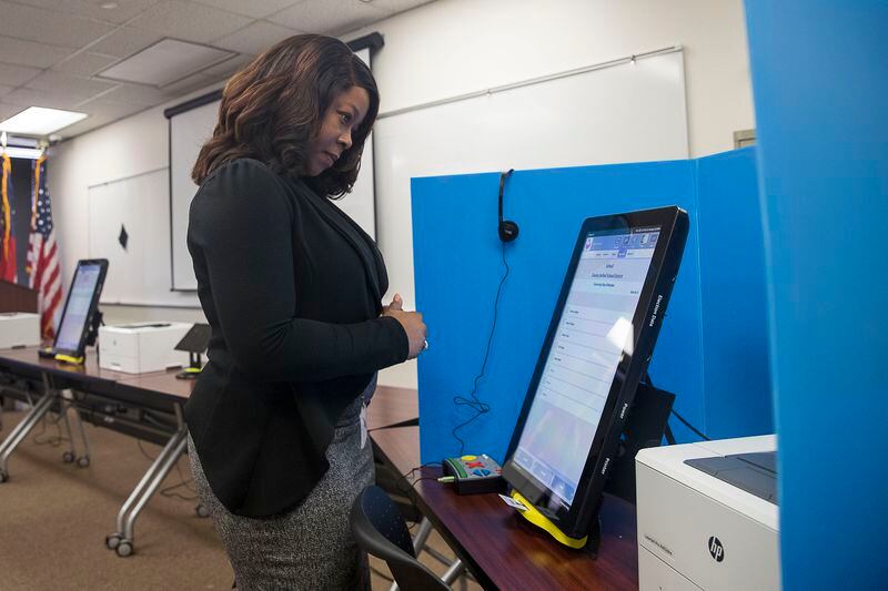 09/16/2019 -- Atlanta, Georgia -- Breanna Thomas, Election liaison for the Georgia Secretary of State, uses the new Georgia voting machines at the James H. "Sloppy" Floyd building in Atlanta, Monday, September 16, 2019. (Alyssa Pointer/alyssa.pointer@ajc.com)