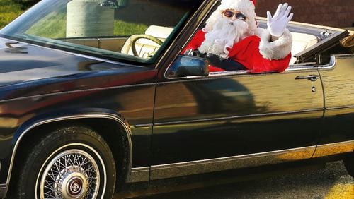 There’s no indication that the Santa on Marietta Square will be in an antique Cadillac convertible, but this picture was too fun not to use.
