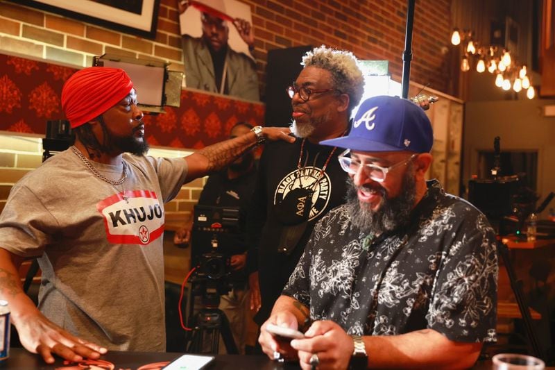 Khujo Goodie of the group Goodie Mob, with AJC reporter Ernie Suggs and AJC filmmaker Tyson Horne.