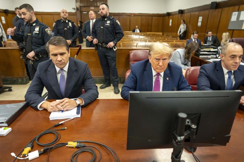 Former President Donald Trump and his lawyer Todd Blanche appear at Manhattan criminal in New York, Friday, April 19, 2024. (Mark Peterson/Pool Photo via AP)