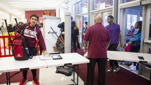 Students walk through security at Maynard Jackson High School in Atlanta on Tuesday, Jan. 10, 2023. Atlanta Public Schools has implemented a new weapons detection system called Evolv in its middle and high schools. (Christina Matacotta for The Atlanta Journal-Constitution)