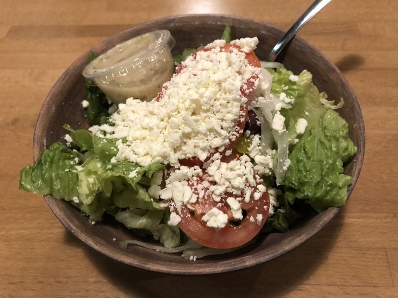 A Greek salad will go nicely with your pie at Junior’s Pizza. CONTRIBUTED BY WENDELL BROCK