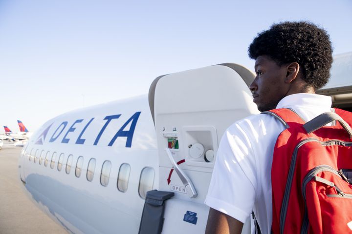 A participant of Delta’s Dream Flight 2022 looks out at the runway before boarding a plane at Hartsfield-Jackson Atlanta International Airport on Friday, July 15, 2022. Around 150 students ranging from 13 to 18 years old will fly from Atlanta to the Duluth Air National Guard Base in Duluth, Minnesota. (Chris Day/Christopher.Day@ajc.com)