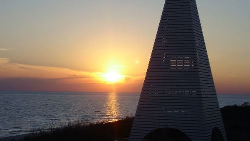 Watching the sunset from the Tarpon Club at Bud & Alley's in Seaside is a great way to end the day. Shown is a pavilion over one of the beach accesses.