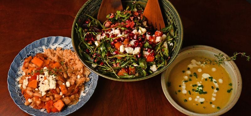 Some inspiring dishes for your winter menu, courtesy of Tatiana Gonzalez, include: White Bean Chili with Sweet Potatoes (bottom left), Butternut Squash, Beet, Couscous and Arugula Salad (top center) and Potato Leek Soup (bottom right). (Styling by Tatiana Gonzalez / Chris Hunt for the AJC)
