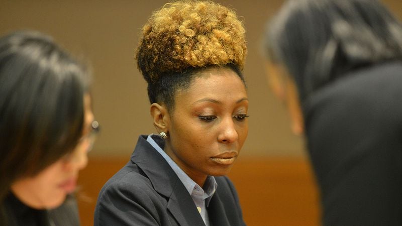 Starlette Mitchell, a former teacher at Parks Middle School, prepares for her plea agreement in 2014. (KENT D. JOHNSON / KDJOHNSON@AJC.COM)
