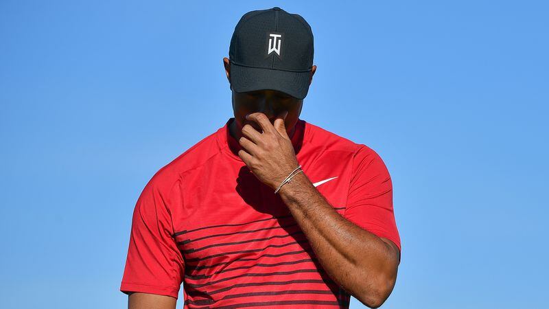 Tiger Woods reacts after a putt on the 13th green during the final round of the Farmers Insurance Open at Torrey Pines South  on Jan. 28, 2018 in San Diego.