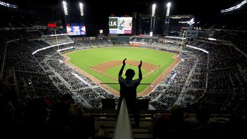 Usher Melvin Russ dances in the aisle during the sixth inning of an exhibition spring training baseball game between the Atlanta Braves and the New York Yankees at the Brave’s new stadium, SunTrust Park, in Atlanta, Friday, March 31, 2017. (AP Photo/David Goldman)