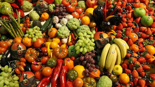 Fresh fruits and vegetables lie on display.