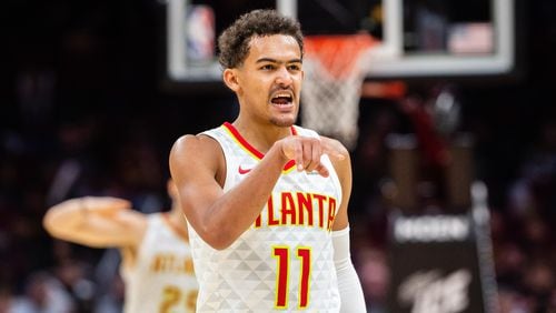 Trae Young of the Atlanta Hawks celebrates after the Hawks scored against the Cleveland Cavaliers during the second half at Quicken Loans Arena on October 21, 2018 in Cleveland, Ohio.