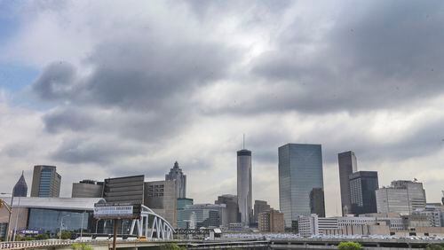 Dark clouds loomed overhead the Atlanta skyline downtown Monday, June 30, 2014 as scattered afternoon storms threatened. Channel 2 Meteorologist Karen Minton forecast for Tuesday will be partly cloudy with isolated afternoon and evening storms. Chance of rain will be 20%. The high will be 93 and the low 72. JOHN SPINK/JSPINK@AJC.COM