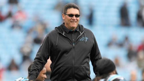 Carolina Panthers head coach Ron Rivera watches his team warm up before an NFL football game against the Atlanta Falcons in Charlotte, N.C., Saturday, Dec. 24, 2016. (AP Photo/Mike McCarn)
