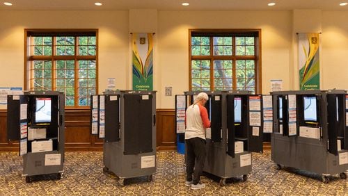 A Fulton County voter votes on primary election day at St. Luke’s Episcopal Church in Atlanta on Tuesday, May 21, 2024. (Arvin Temkar / AJC)