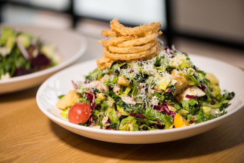  Howell's Chopped Salad with chopped greens, smoked turkey, salami, fontinella, garbanzo beans, olives, pepperoncini, tomato, brioche croutons, crispy onion, and red wine vinaigrette. Photo credit- Mia Yakel.