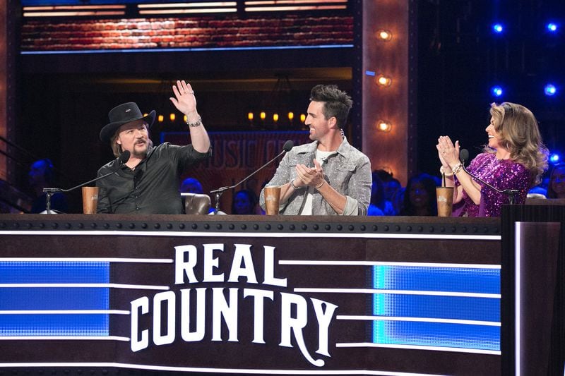 REAL COUNTRY -- "Drink Up Party Down" Episode 101 -- Pictured: (l-r) Travis Tritt, Jake Owen, Shania Twain -- (Photo by: CJ Hicks/USA Network)