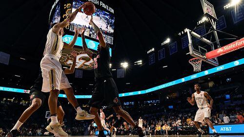 ATLANTA, GA - JANUARY 07: Josh Heath #11 of the Georgia Tech Yellow Jackets works to avoid a Louisville trap during the game at Hank McCamish Pavilion on January 7, 2017 in Atlanta, Georgia. (Photo by Mike Comer/Getty Images)