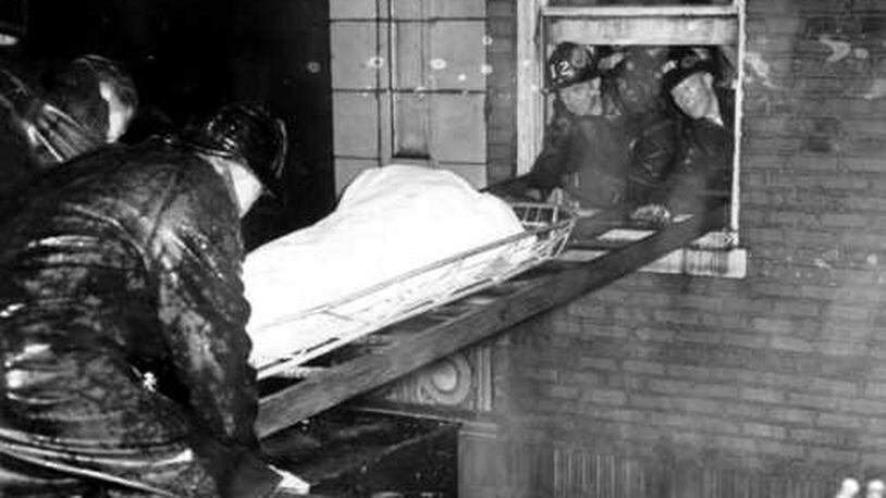 Atlanta firefighters remove bodies from the Winecoff Hotel on Dec. 7, 1946. The fire killed 119 people.