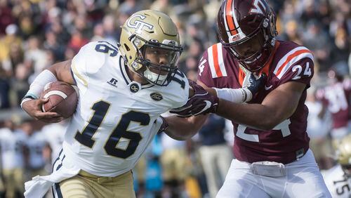 Georgia Tech quarterback TaQuon Marshall (16) rushes as Virginia Tech linebacker Anthony Shegog (24) defends during the first half of a football game on Saturday, Nov.11, 2017, in Atlanta. (Photo/John Amis)