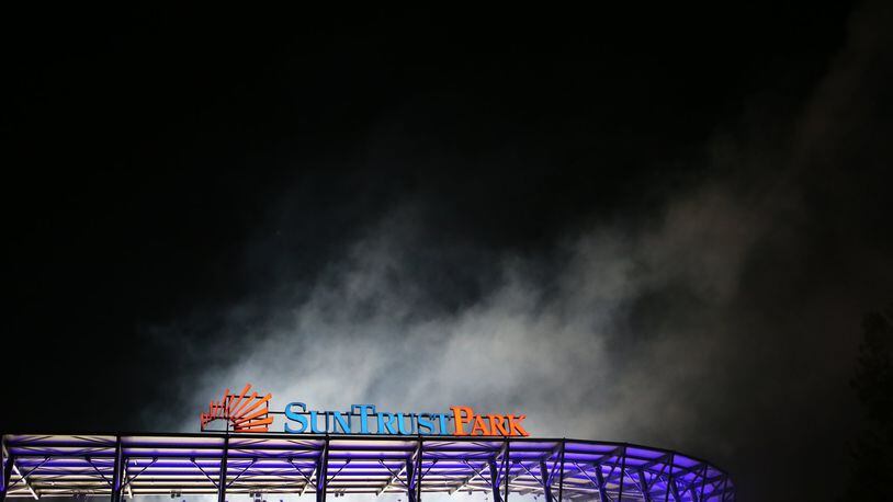 April 14, 2017, Atlanta, Georgia - The fireworks leave a cloud of smoke hovering above the stadium after the Atlanta Braves Opening Game at Suntrust Parkin Cobb County, Georgia, on April 14, 2017. (HENRY TAYLOR / HENRY.TAYLOR@AJC.COM)