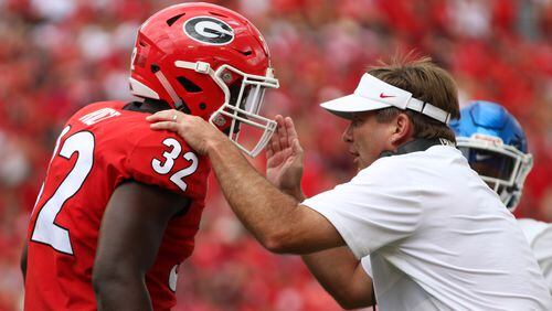 Georgia head coach Kirby Smart directs inside linebacker Monty Rice (32) against Middle Tennessee State University Saturday, Sep., 15, 2018, in Stanford Stadium in Athens.
