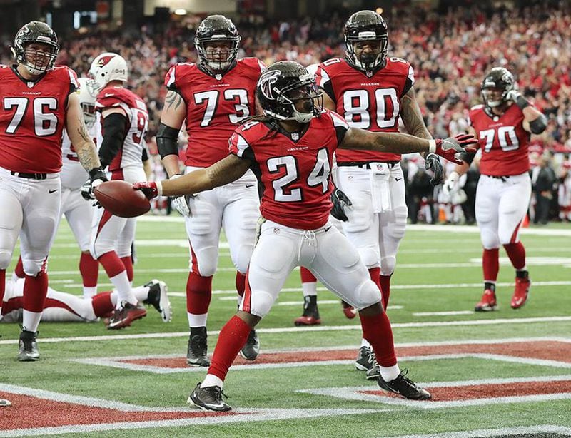  Falcons running back Devonta Freeman spikes the ball after scoring a touchdown against the Arizona Cardinals to tie the game 7-7 during the first quarter Sunday, Nov. 27, 2016, at the Georgia Dome in Atlanta. (Curtis Compton/ccompton@ajc.com)
