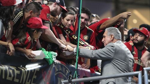 Atlanta United owner Arthur Blank Celebrates with the fans after the victory against the Philadelphia Union the team clinch one of the six playoffs spots in the Eastern Conference last season.