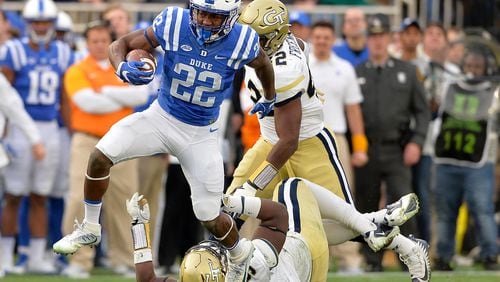 DURHAM, NC - NOVEMBER 18:  Brittain Brown #22 of the Duke Blue Devils breaks away from Brentavious Glanton #97 of the Georgia Tech Yellow Jackets for a long gain during their game at Wallace Wade Stadium on November 18, 2017 in Durham, North Carolina.  (Photo by Grant Halverson/Getty Images)