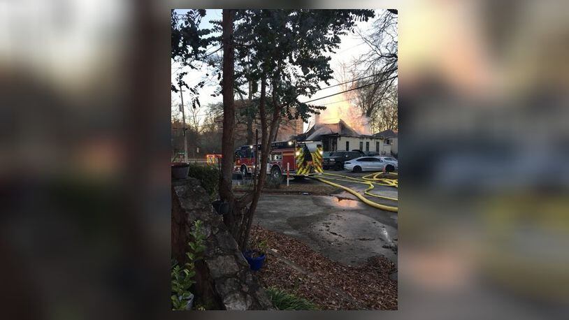 An early morning fire at the Cheney Street Lodge in East Point left 14 people displaced Tuesday, according to Red Cross volunteers. (Credit: East Point Fire Department)