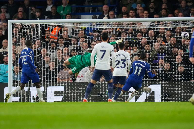 Chelsea's Trevoh Chalobah, not seen, scores his side's opening goal during the English Premier League soccer match between Chelsea and Tottenham Hotspur at Stamford Bridge stadium in London, Thursday, May 2, 2024. (AP Photo/Kirsty Wigglesworth)