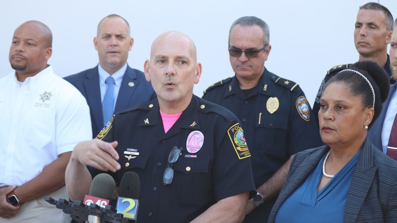 Former Lawrenceville Police Chief Tim Wallis, seen here at a press conference in October, has filed a lawsuit against the city and City Manager Chuck Warbington, claiming Warbington violated his First Amendment rights. Wallis says the city manager barred him from publicly defending himself against sexual harassment allegations, then forced him out of his job for allegedly violating the order. (Tyler Wilkins / Tyler.Wilkins@ajc.com)