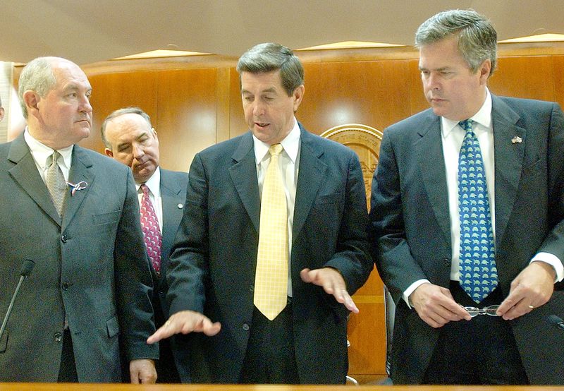 In 2003, Georgia Gov. Sonny Perdue, left, met with Alabama Gov. Bob Riley, center, and Florida Gov. Jeb Bush, right, as part of the Apalachicola-Chattahoochee-Flint River Basin Commission. That year, the commission, which had been formed six years earlier, dissolved when no agreement could be reached on water rights. (Phil Coale / AP file)