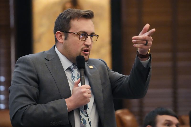 Mississippi State Rep. Jansen Owen, R-Poplarville, asks a question regarding a bill to regulate transgender people's use of bathrooms, locker rooms and dormitories in public education buildings, before the House at the state Capitol in Jackson, Miss., Thursday, May 2, 2024. (AP Photo/Rogelio V. Solis)