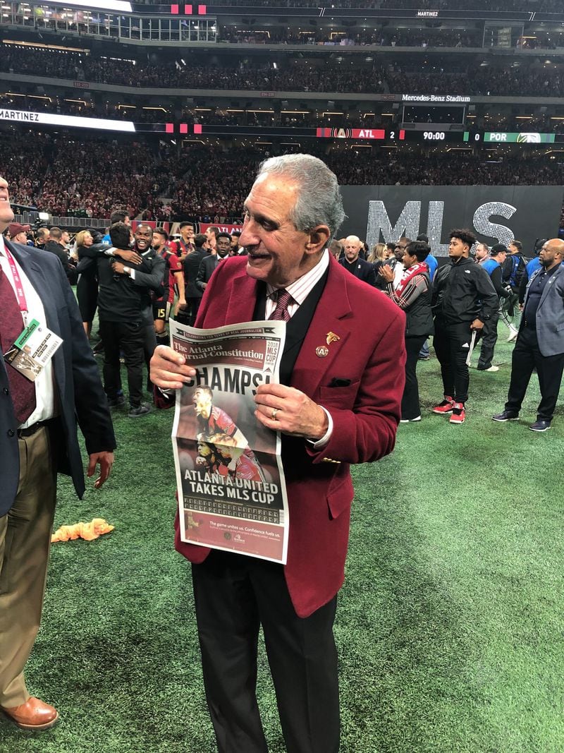 Atlanta United owner Arthur Blank shares the good news of the MLS Cup victory on Saturday night inside Mercedes-Benz Stadium. (Photo: Greg Bluestein/AJC)