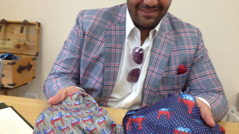Atlanta tailor Neil Balani of HKT Custom Clothiers shows off the Democrat and Republican linings customers can choose for their jackets. The linings have proved to be quite the conversation pieces, he said, this year. GRACIE BONDS STAPLES / GSTAPLES@AJC.COM