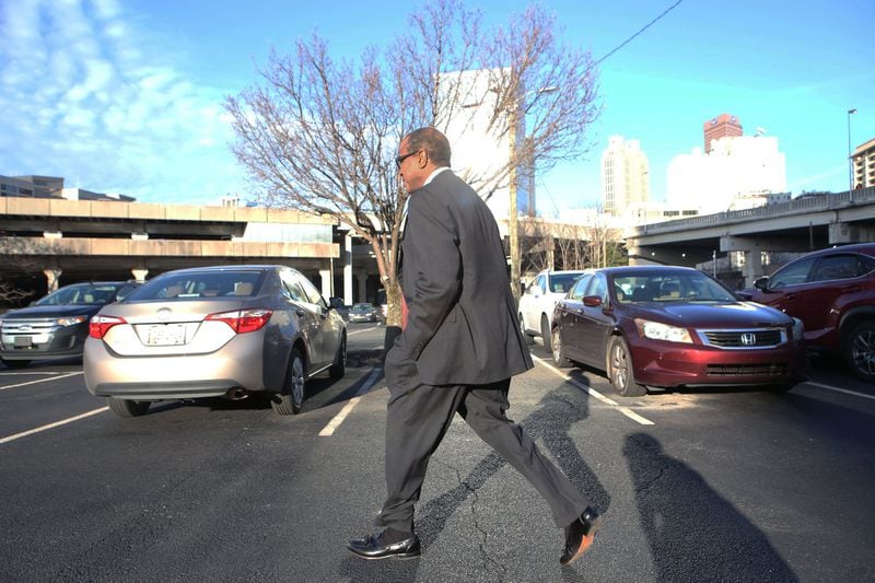Elvin “E.R” Mitchell Jr. returns to his car after pleading guilty in the Atlanta City Hall bribery investigation on Wednesday, Jan. 25, 2017. (HENRY TAYLOR / HENRY.TAYLOR@AJC.COM)