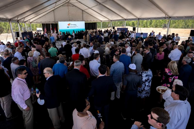 ELLABELL, GEORGIA - MAY 20, 2022:  People gather under a tent for an announcement event at the site where South Korean automotive giant Hyundai Motor Group will build an electric vehicle plant in Ellabell, Ga. It is the second major electric vehicle factory announcement in Georgia since December as state economic development officials try to turn the Peach State into an important manufacturing hub for battery-powered automobiles. (AJC Photo/Stephen B. Morton)