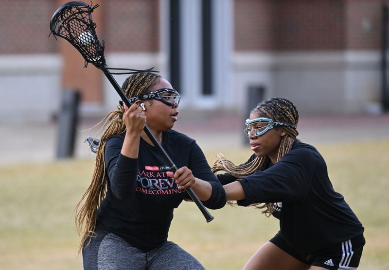 October 25, 2022 Atlanta - Deanna Lindo (midfielder), left, and Kaitlin Britton Wheeler (midfielder), runs through a three-on-two drill during practice. Lindo, the only player on the team from Clark Atlanta University, had dreams of playing Division I lacrosse until the pandemic hit - derailing her plans.
"We all had dreams," said the 19-year-old sophomore. "This has been a good replacement." (Hyosub Shin / Hyosub.Shin@ajc.com)