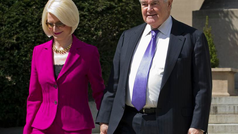 Former House Speaker Newt Gingrich and his wife Callista leave a closed-door meeting with Republican presidential candidate Donald Trump in Washington, Monday, March 21, 2016. (AP Photo/Jose Luis Magana)