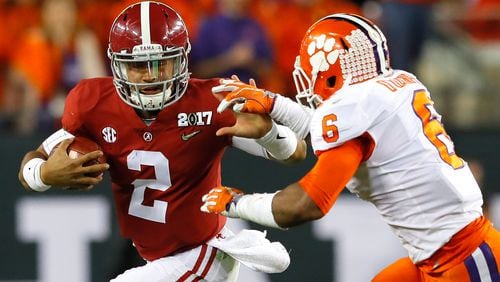 Alabama quarterback Jalen Hurts runs with the ball as Clemson linebacker Dorian O’Daniel attempts to tacke him during the first half of the College Football Playoff championship game at Raymond James Stadium on Monday night. (Photo by Kevin C. Cox/Getty Images)