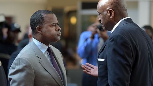Mayor Kasim Reed just let go of Hartsfield-Jackson International Airport General Manager Miguel Southwell, seen here at right with the mayor last November. Southwell's replacement will be the fourth airport GM under Reed since the mayor took office in 2010.