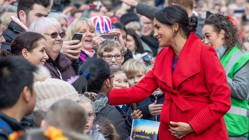 Meghan, Duchess of Sussex greets well-wishers on Hamilton Square as they visit a new statue to mark the 100th anniversary of the death of poet Wilfred Owen, which was erected on Hamilton Square in November, during an official visit to Birkenhead on January 14, 2019.