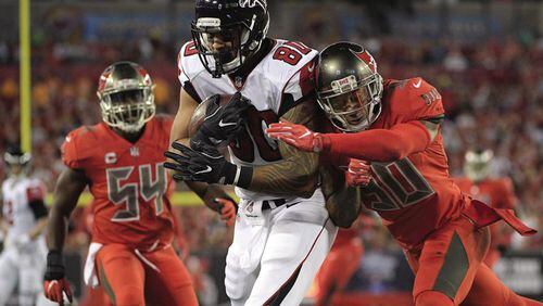 Game9.d Atlanta Falcons tight end Levine Toilolo (80) pulls in a 32-yard touchdown pass after getting pat Tampa Bay Buccaneers free safety Bradley McDougald (30) and outside linebacker Lavonte David (54) during the first quarter of an NFL football game Thursday, Nov. 3, 2016, in Tampa, Fla. (AP Photo/Phelan Ebenhack)